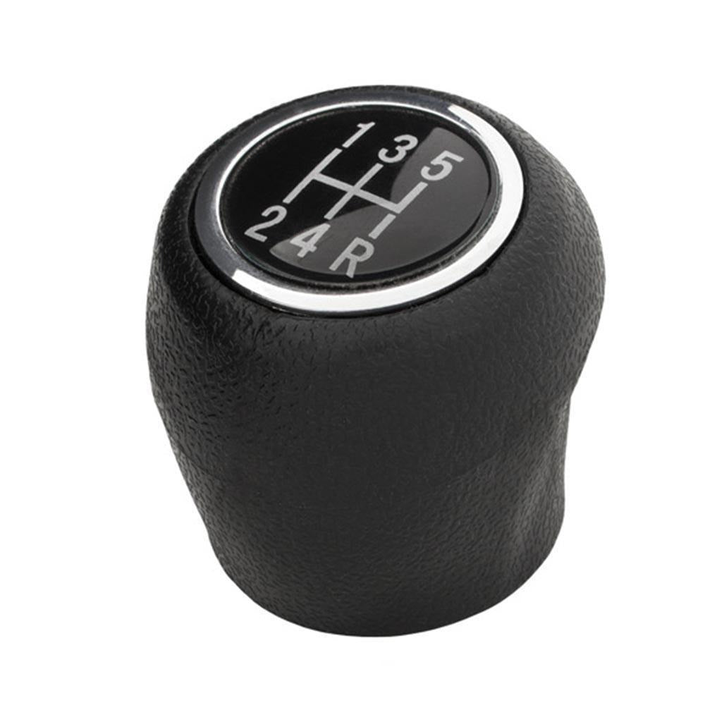 Fekete színű, 5 sebességes Fiat váltógomb. Üveg számlappal és króm számlapkerettel.