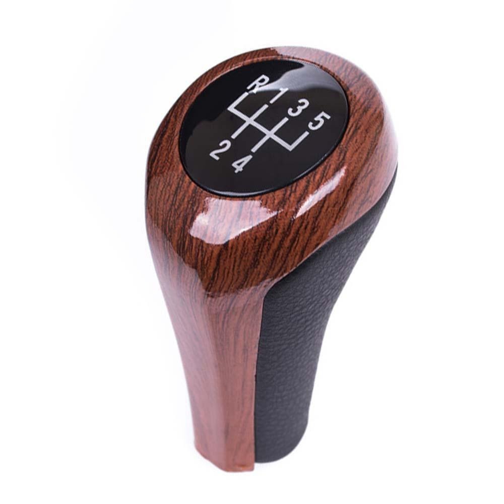 Fa mintás, 5 sebességes BMW váltógomb. Fekete színű számlappal.