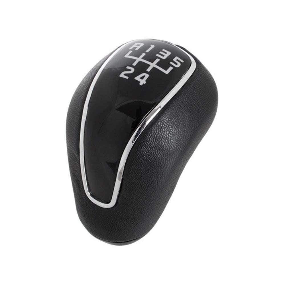 Fekete színű, 5 sebességes Kia váltógomb. Fekete számlappal, króm számlapkerettel.