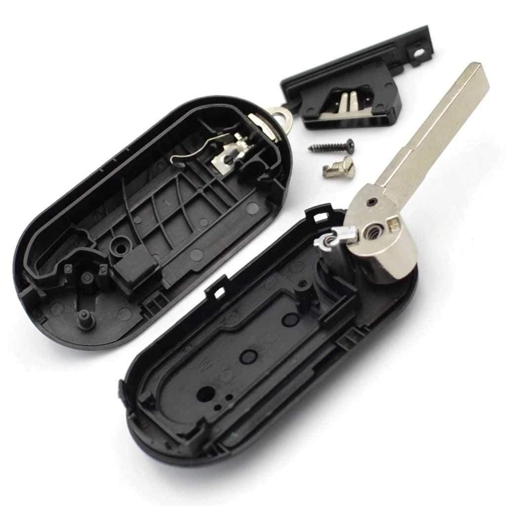 Fekete színű, 2 gombos Fiat bicskakulcs, kulcsház belseje.