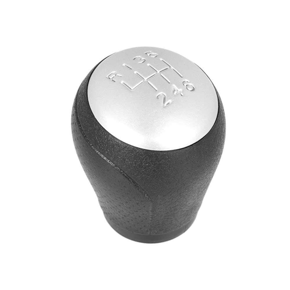 Fekete színű, 6 sebességes Nissan váltógomb. Ezüst színű, 6 fokozatos számlappal.