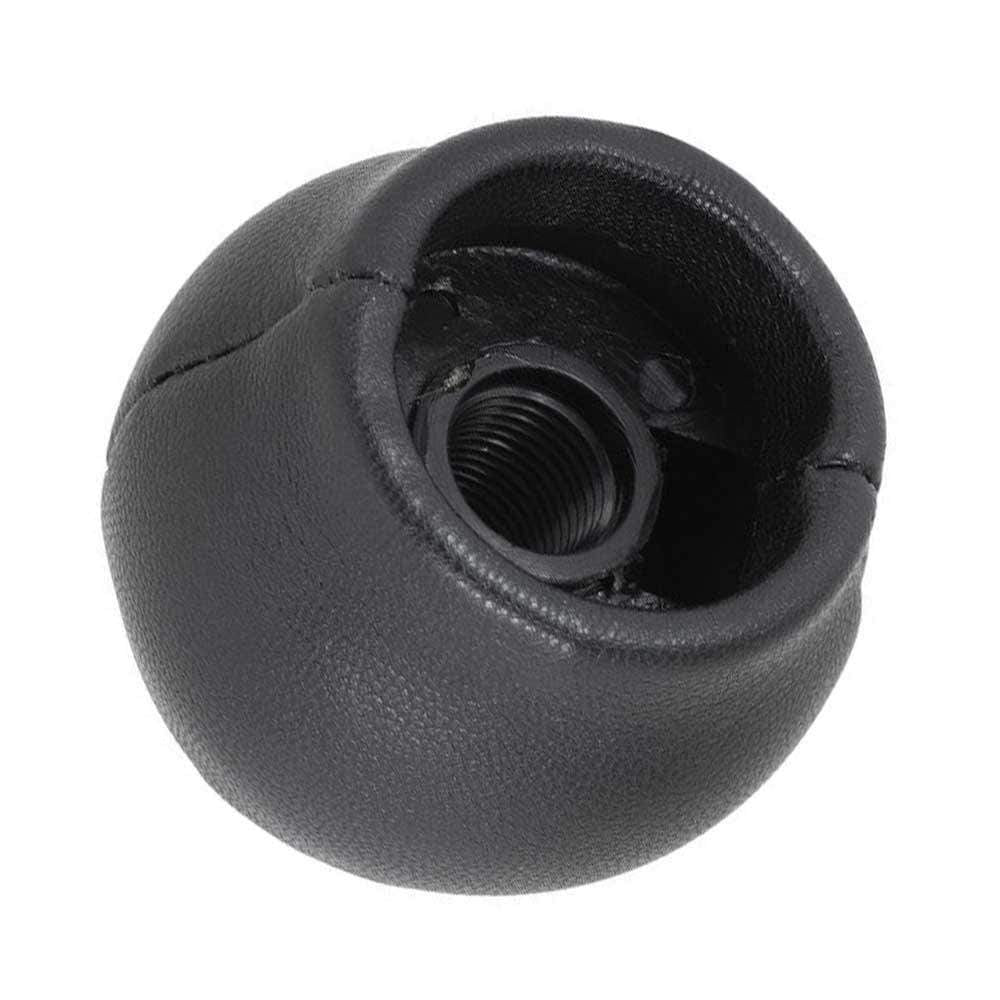 Fekete színű, bőrözött Toyota váltógomb. 