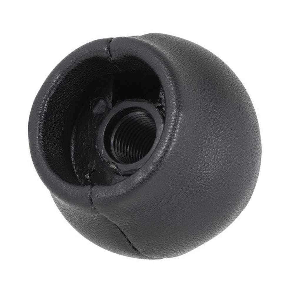 Fekete színű, bőrözött Toyota váltógomb.