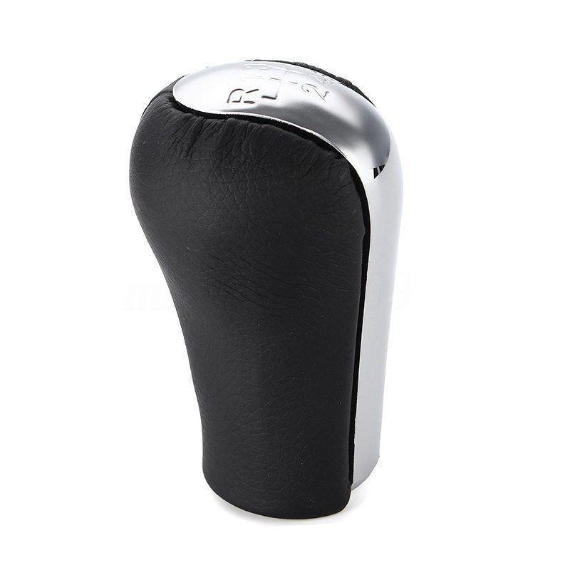 Fekete, krómozott 6 sebességes Toyota váltógomb.